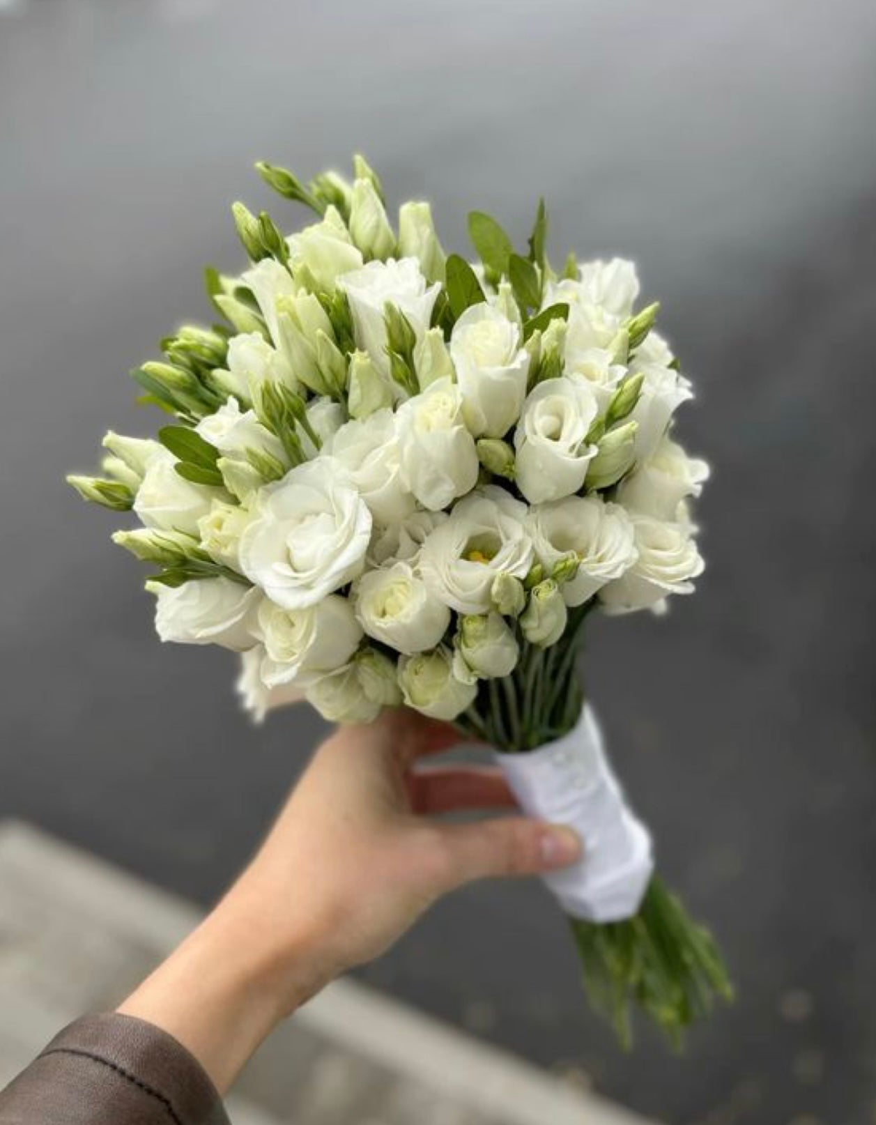 Fresh eustoma wedding bouquet with delicate seasonal blooms