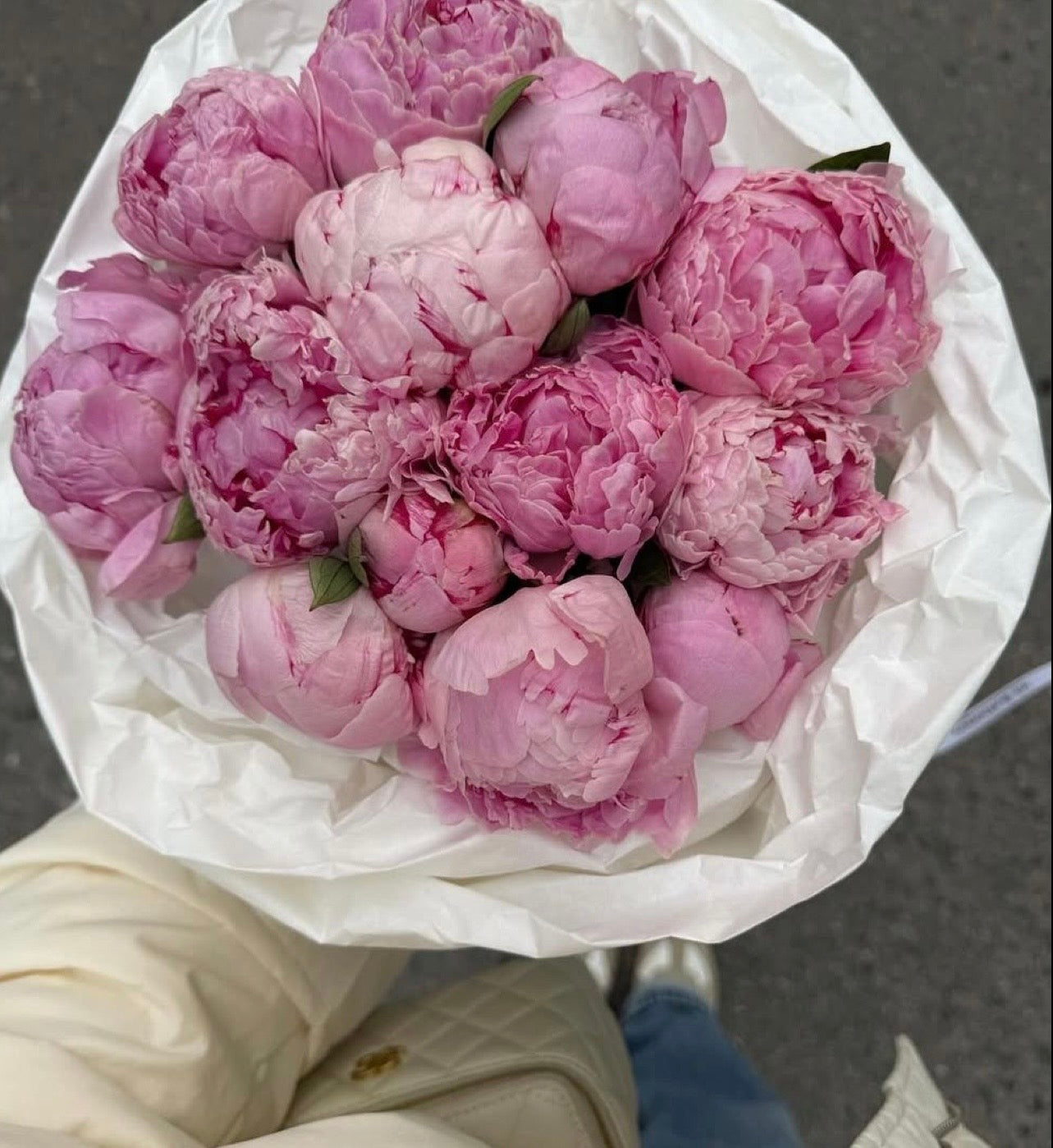 Fresh pink peonies bouquet with seasonal flowers