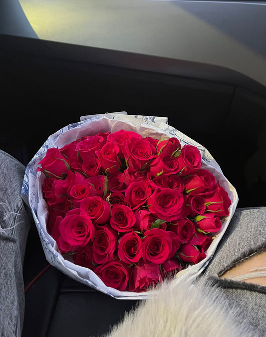 A bouquet of 50 raspberry-red roses (raspberry hue)