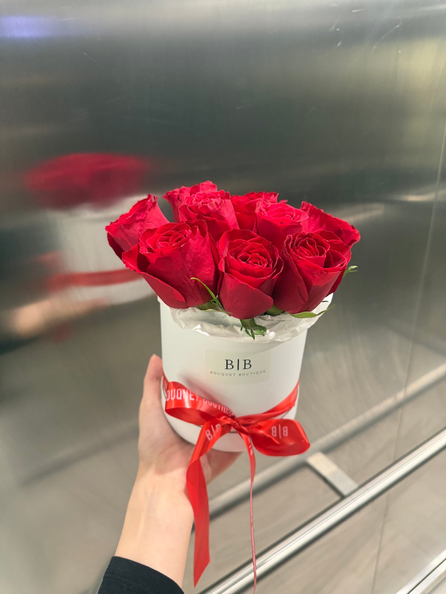 Red roses in a white small box