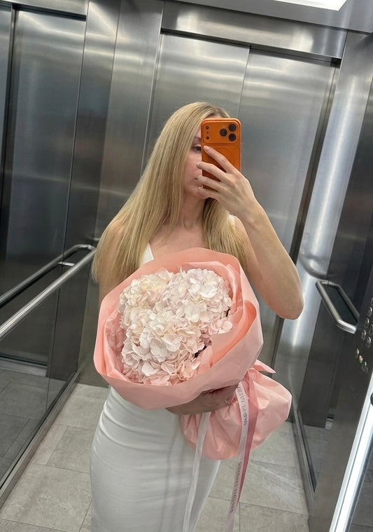 Bouquet of hydrangeas in pink packaging