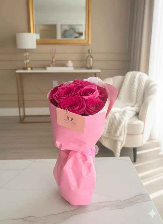 A bouquet of 9 pink roses