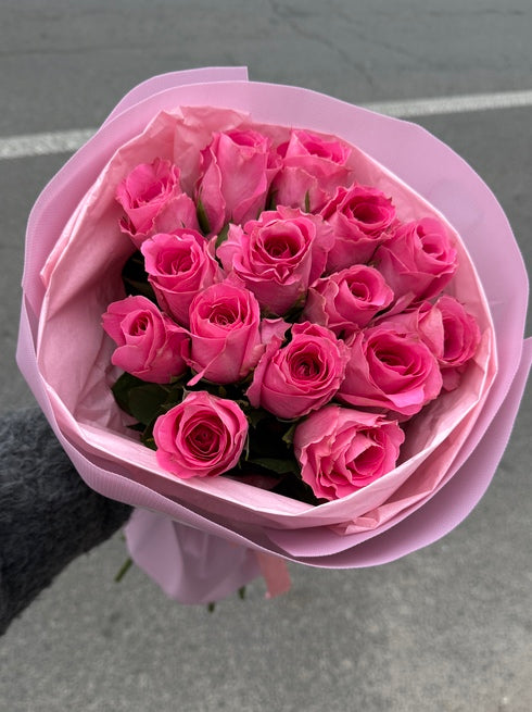 A bouquet of 15 pink roses